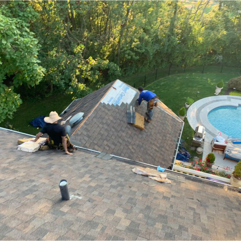 working on roof shingles